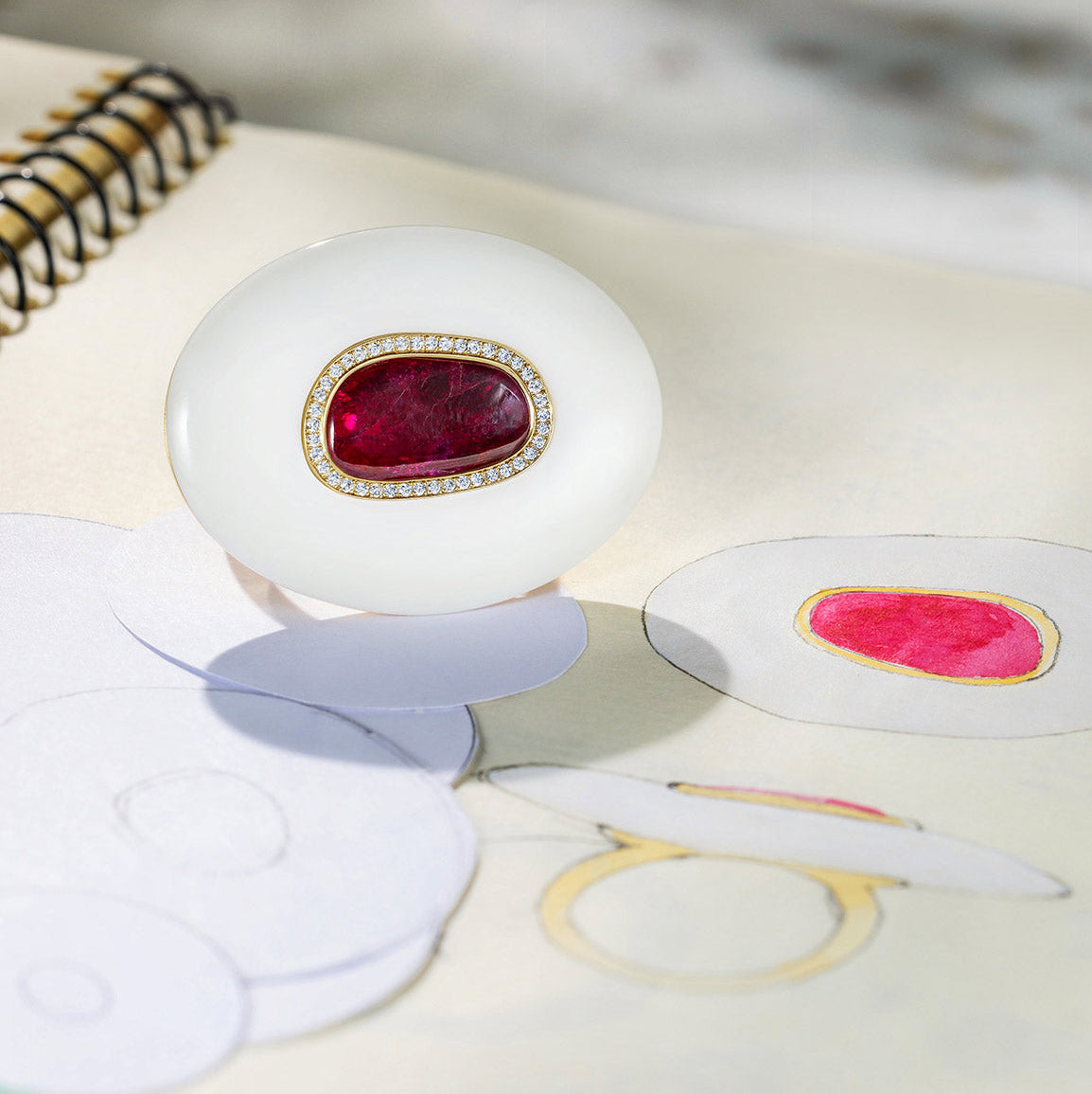 Handcrafted 18K yellow gold Diamond, Ruby & Opal Pebble Ring featuring a 3.21ct ruby slice framed by diamond pavé and set in hand-carved white opal by Isabella Roux.