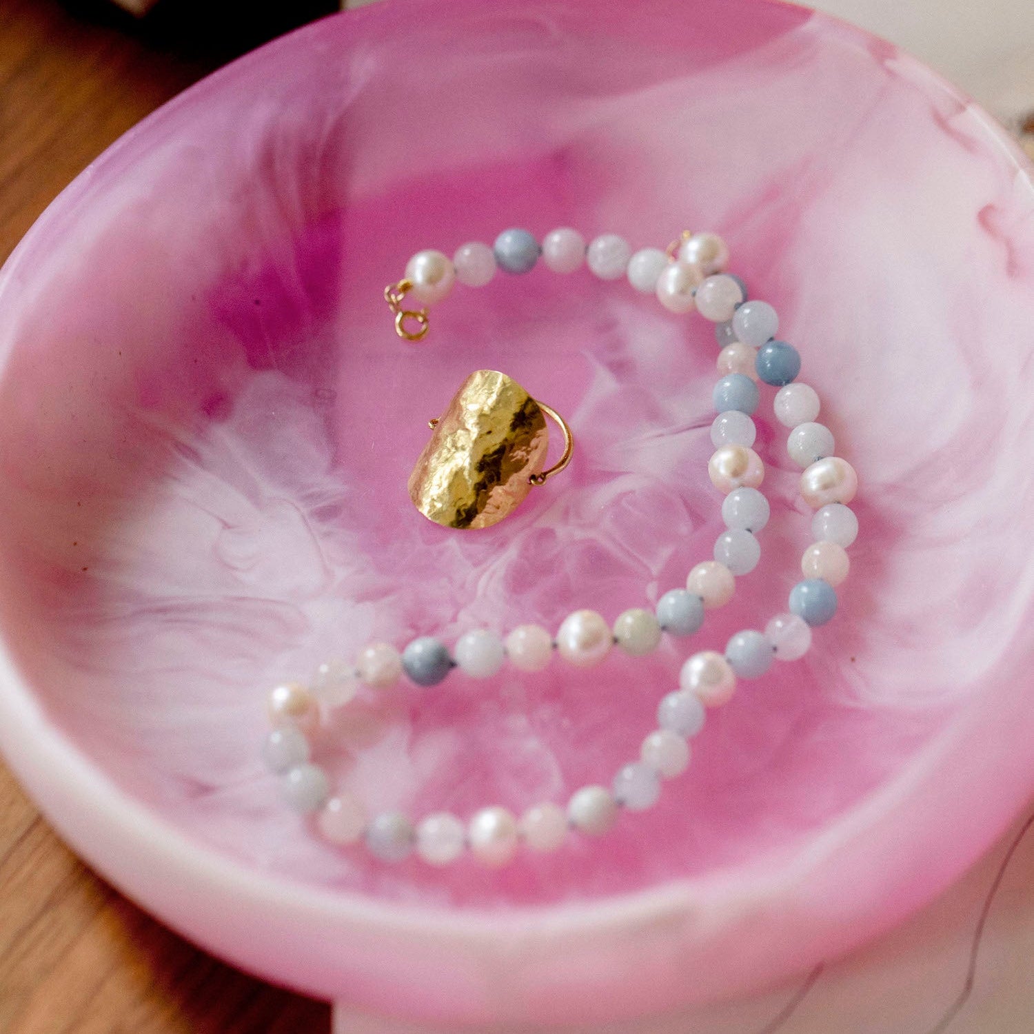 Example of 18K yellow gold Grand Sun Shield Wrap Ring featuring a large 35mm hand-hammered gold sheet that wraps the finger by Isabella Roux