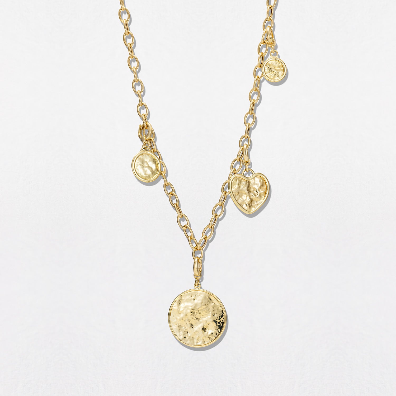 Hand-beaten 18K yellow gold Sun Disc Charm Pendant II featuring a 15mm textured gold disc with a smooth bezel and detachable clasp by Isabella Roux