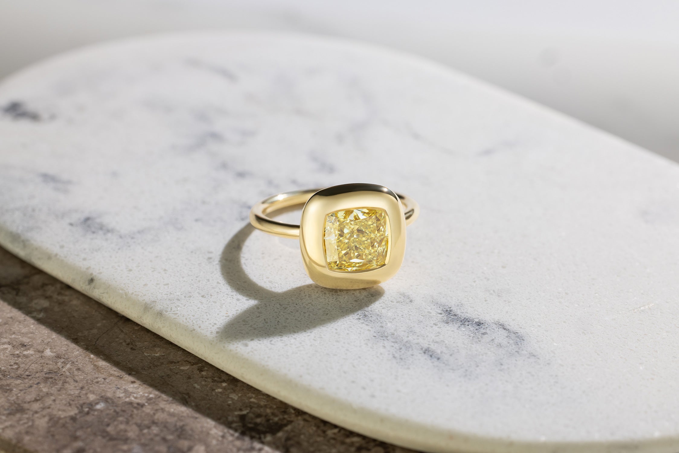 Handcrafted 18K yellow gold Yellow Diamond Cushion Cup Ring featuring a 2.21ct cushion cut lab grown yellow diamond set in a bezel style cup by Isabella Roux