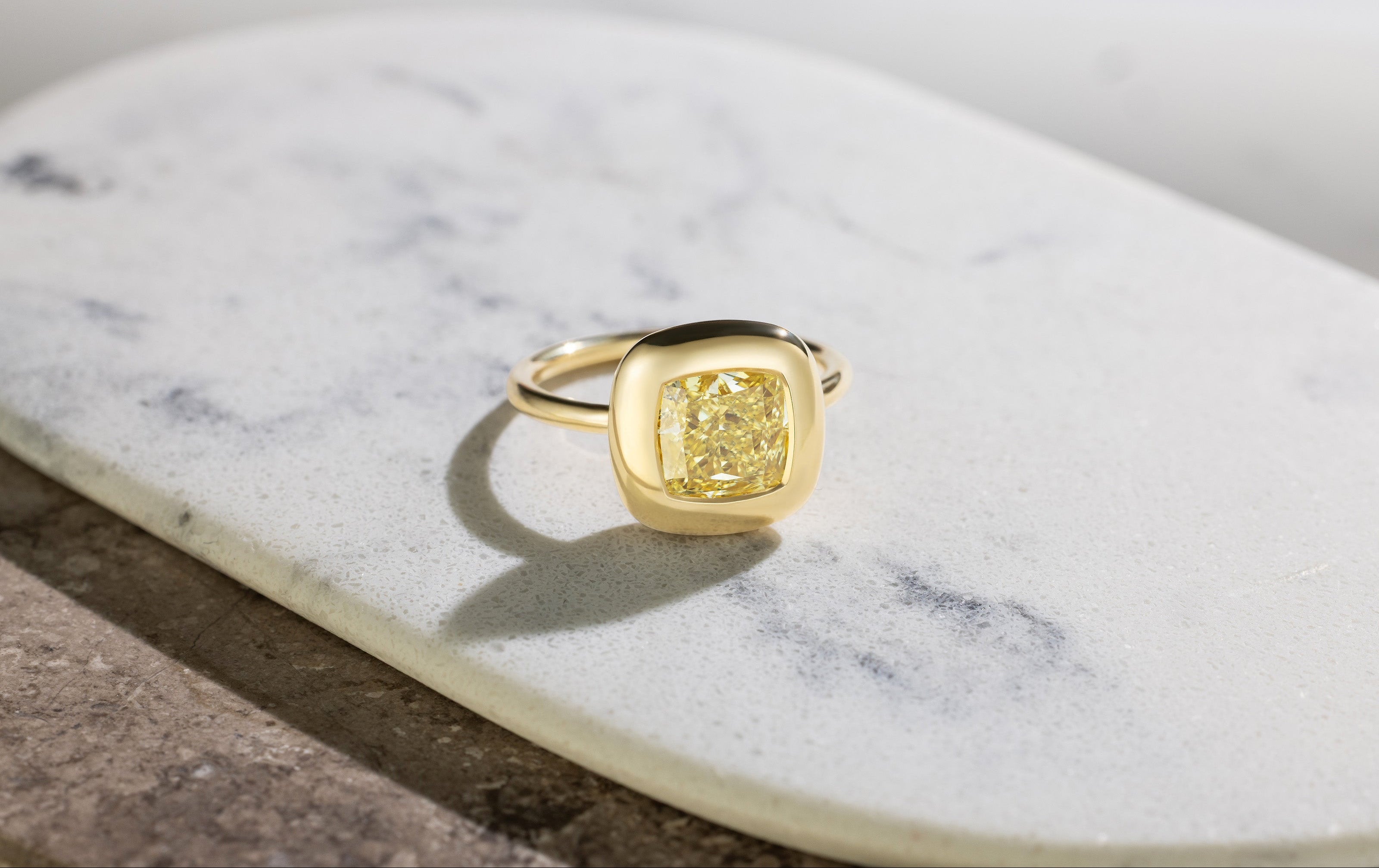 Handcrafted 18K yellow gold Yellow Diamond Cushion Cup Ring featuring a 2.21ct cushion cut lab grown yellow diamond set in a bezel style cup by Isabella Roux