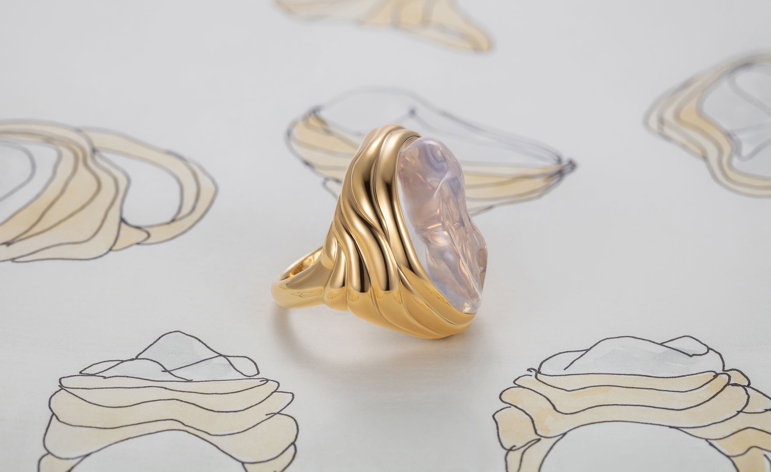 Large 18k gold gold ring with a large gemstone on a white background with wave design by Isabella Roux