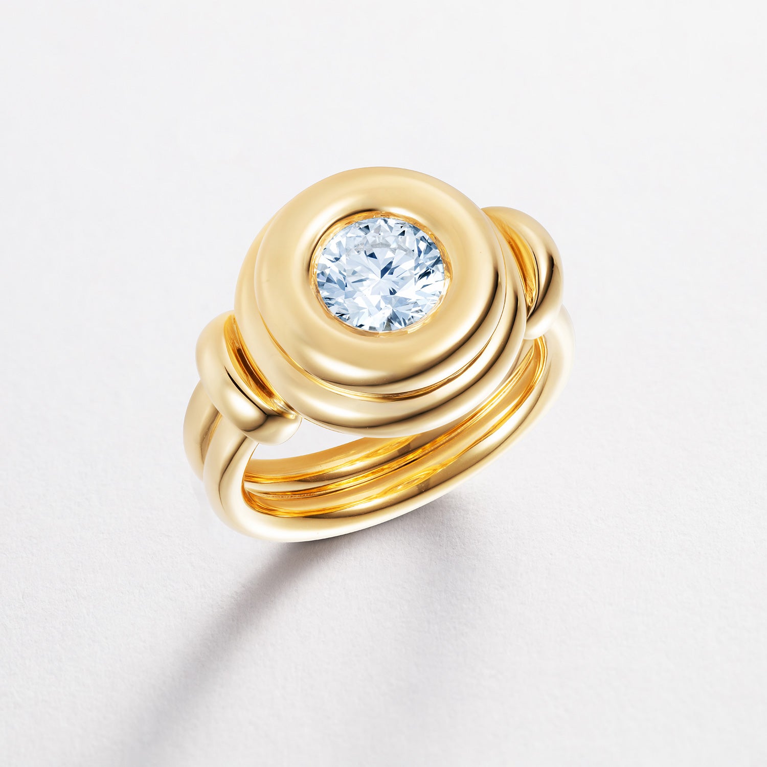 Bespoke Love Wrap ring with a diamond on a light gray background by Isabella Roux
