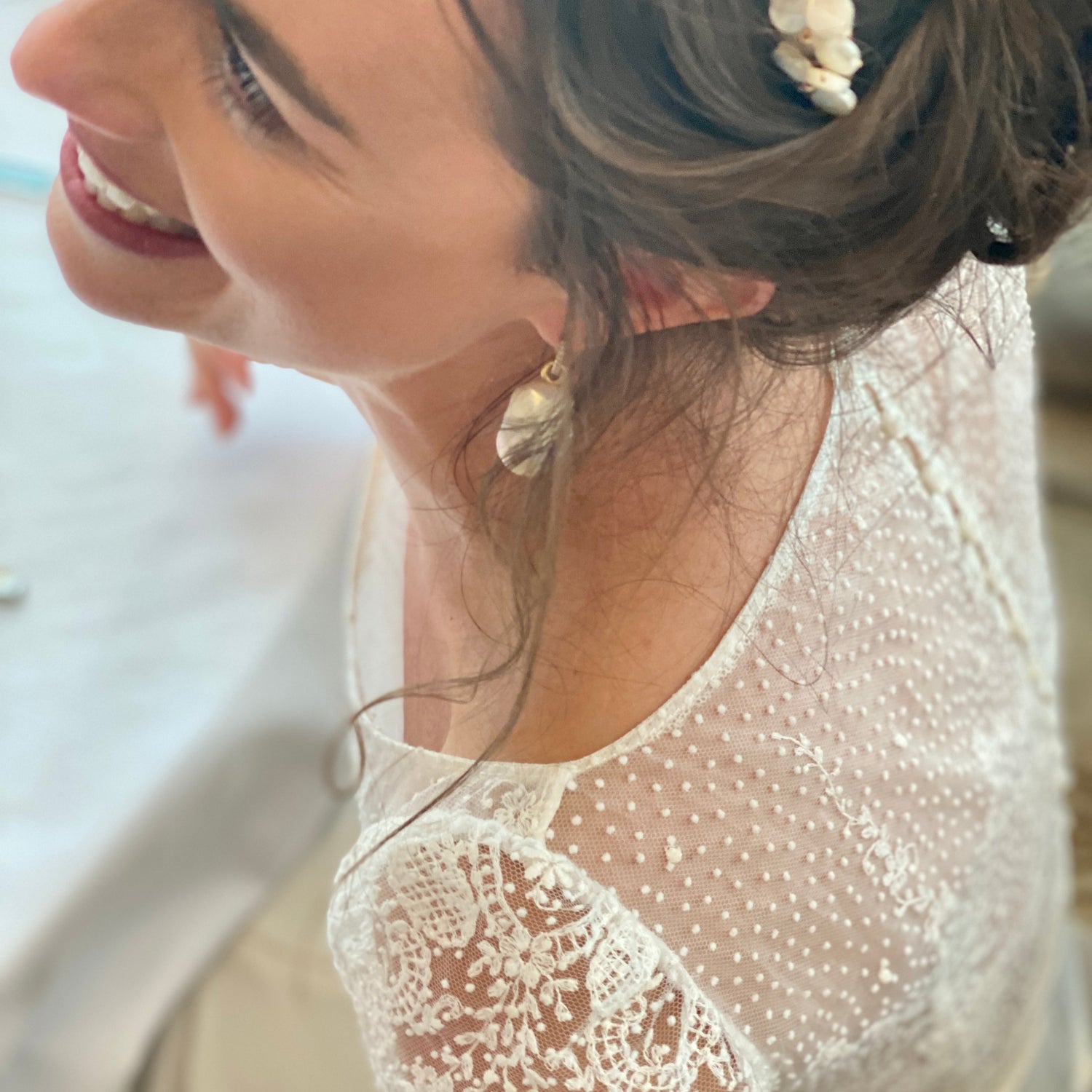 Woman wearing 18K yellow gold Baroque Pearl & Diamond Earrings featuring 12mm diamond pavé huggie hoops with detachable organic white freshwater baroque pearl drops by Isabella Roux