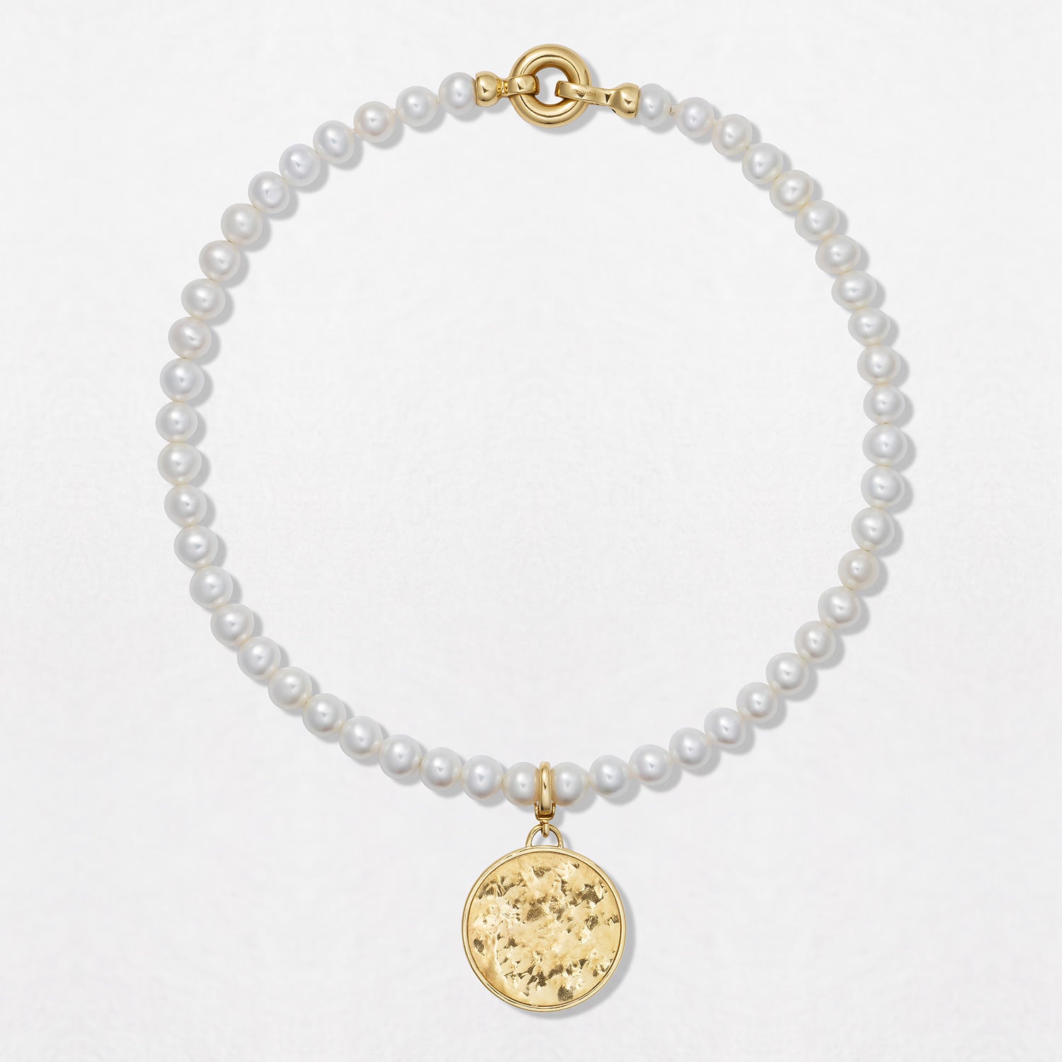 Handcrafted Classic Pearl Choker Necklace featuring 7mm white freshwater pearls strung with an 18K yellow gold clasp at a 15" length by Isabella Roux