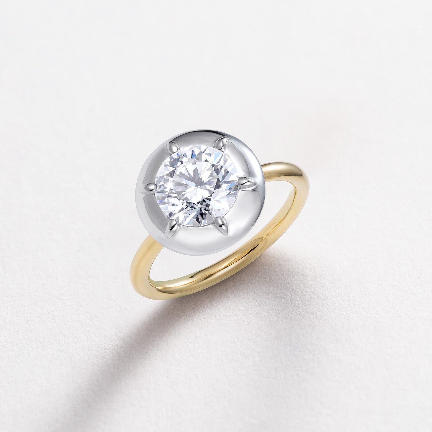 Bespoke 18K white and yellow gold Diamond Cup Ring featuring a 1.52ct round brilliant lab grown diamond set in a signature bezel style cup by Isabella Roux.