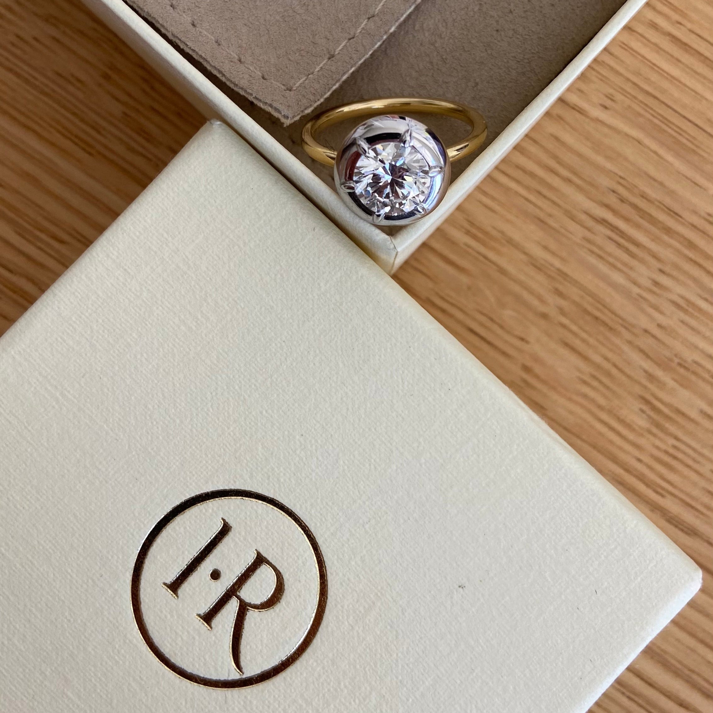 Bespoke 18K white and yellow gold Diamond Cup Ring featuring a 1.52ct round brilliant lab grown diamond set in a signature bezel style cup by Isabella Roux.