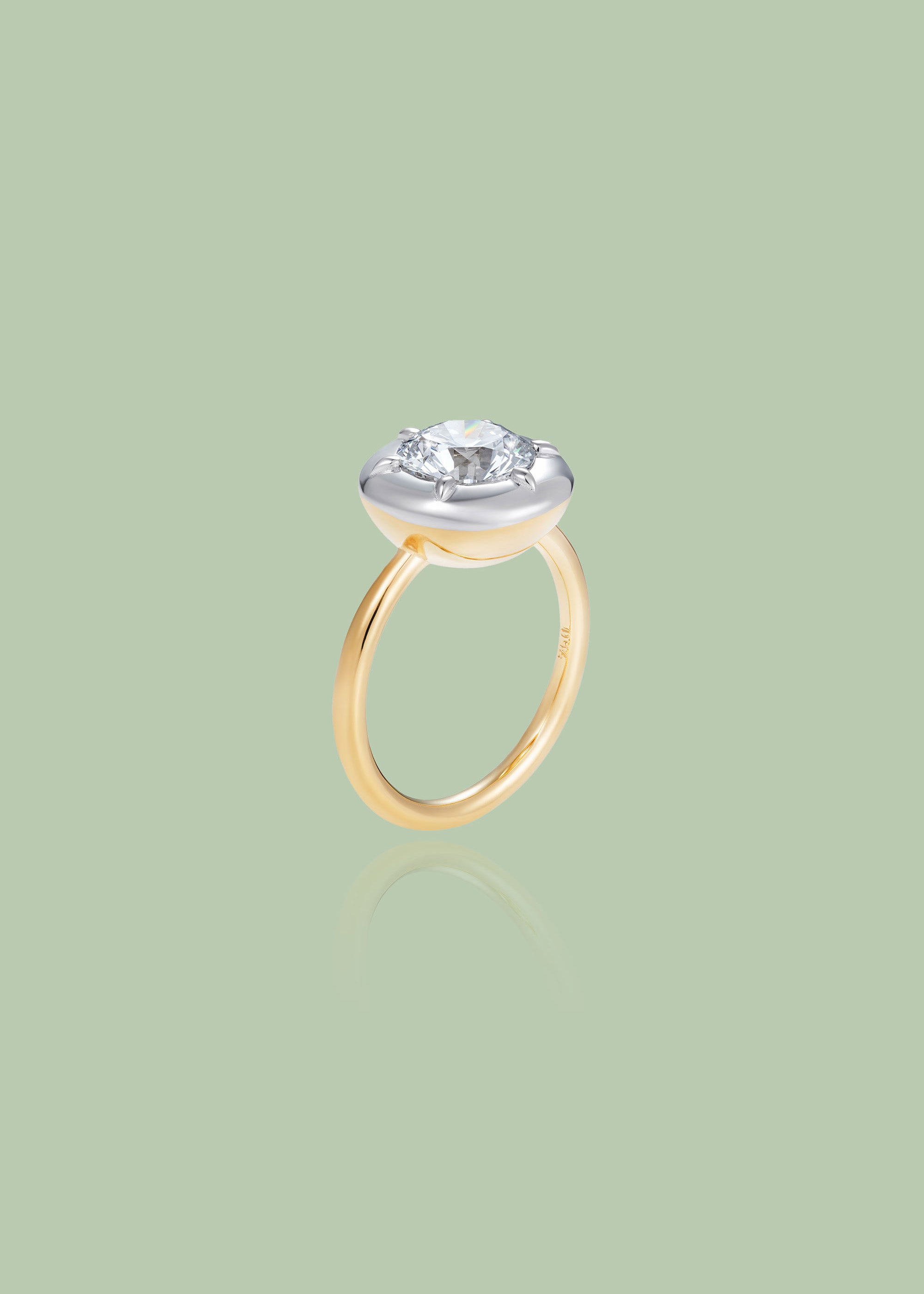 Bespoke 18K white and yellow gold Diamond Cup Ring featuring a 1.52ct round brilliant lab grown diamond set in a signature bezel style cup by Isabella Roux