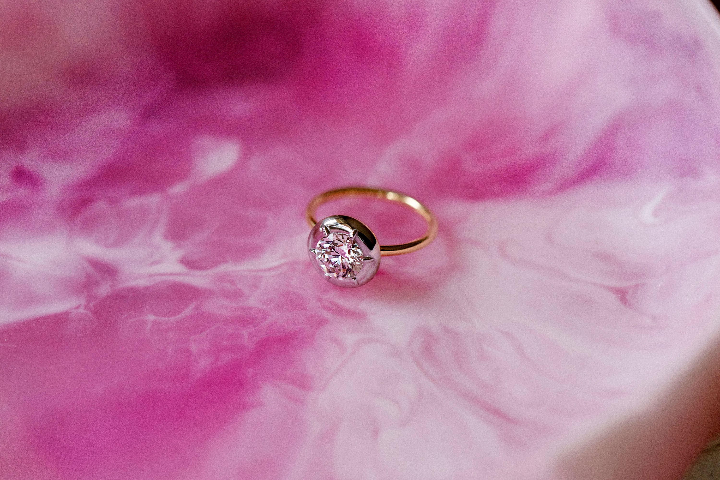 Bespoke 18K white and yellow gold Diamond Cup Ring featuring a 1.52ct round brilliant lab grown diamond set in a signature bezel style cup by Isabella Roux