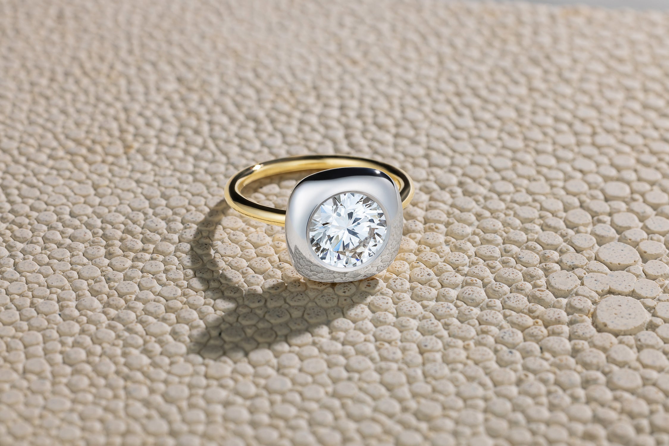 Handcrafted 18K yellow and white gold Diamond Cushion Cup Ring featuring a 2.06ct cushion cut lab grown white diamond set in a bezel style cup by Isabella Roux