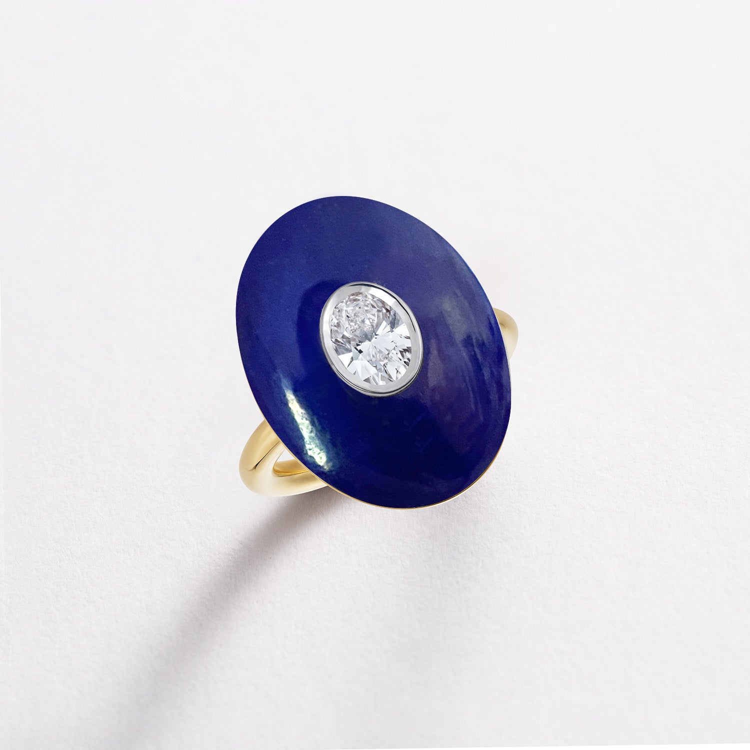 Hand-carved 18K yellow & white gold Diamond & Lapis Pebble Ring featuring a 0.71ct oval lab grown diamond set inside hand-carved lapis lazuli by Isabella Roux.