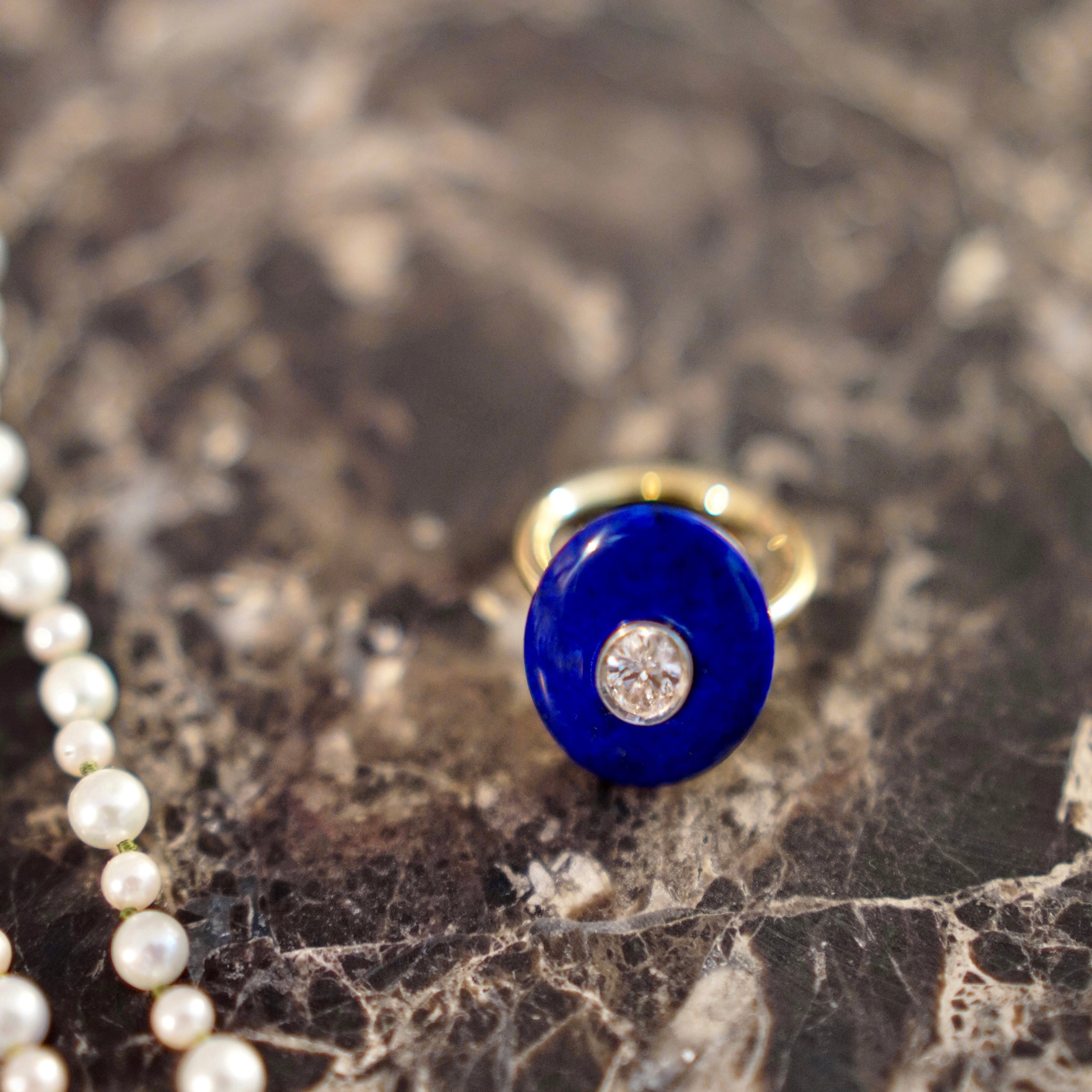 Hand-carved 18K yellow & white gold Diamond & Lapis Pebble Ring featuring a 0.71ct oval lab grown diamond set inside hand-carved lapis lazuli by Isabella Roux.