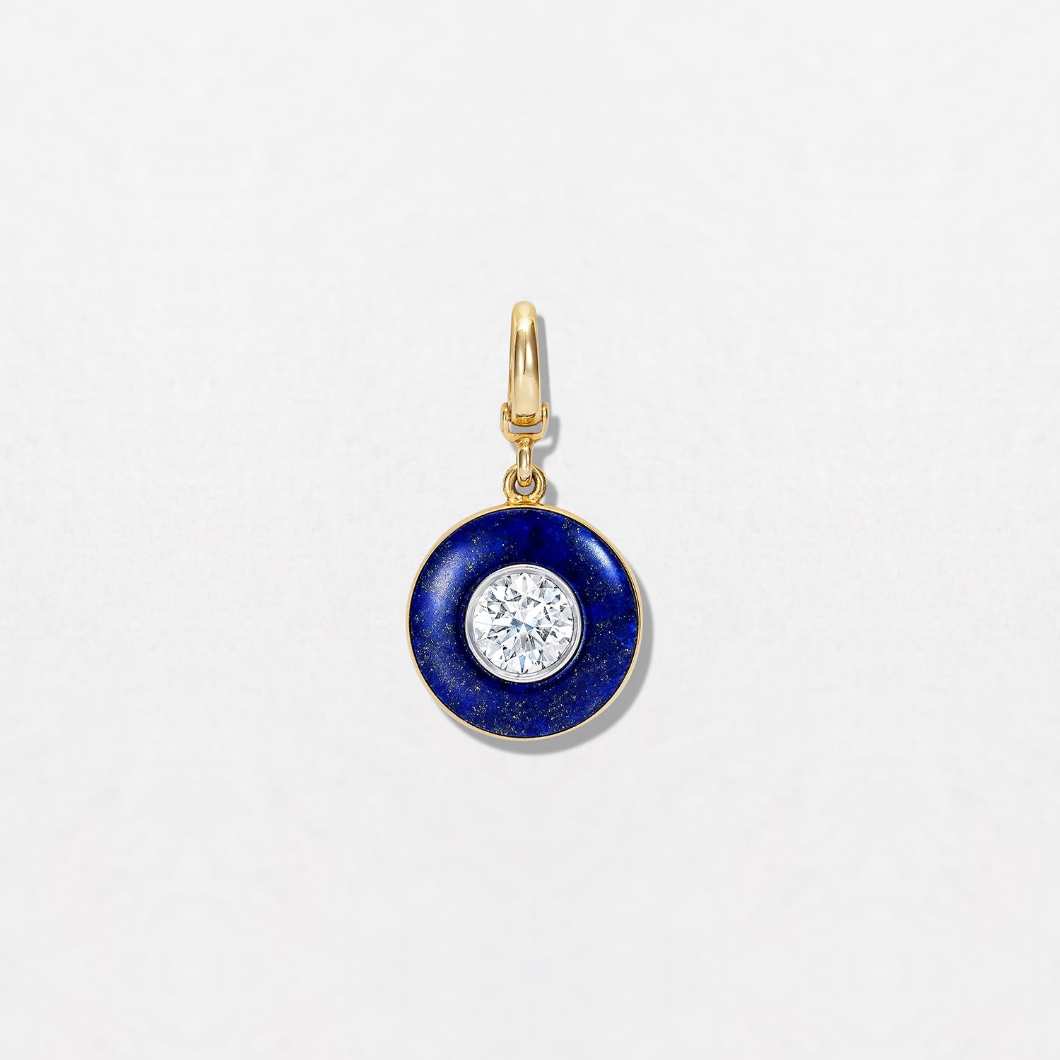 Handcrafted 18K yellow gold Diamond Lapis Pendant featuring a 1.55ct round brilliant lab grown diamond surrounded by a deep blue lapis lazuli inlay with a detachable clasp by Isabella Roux.