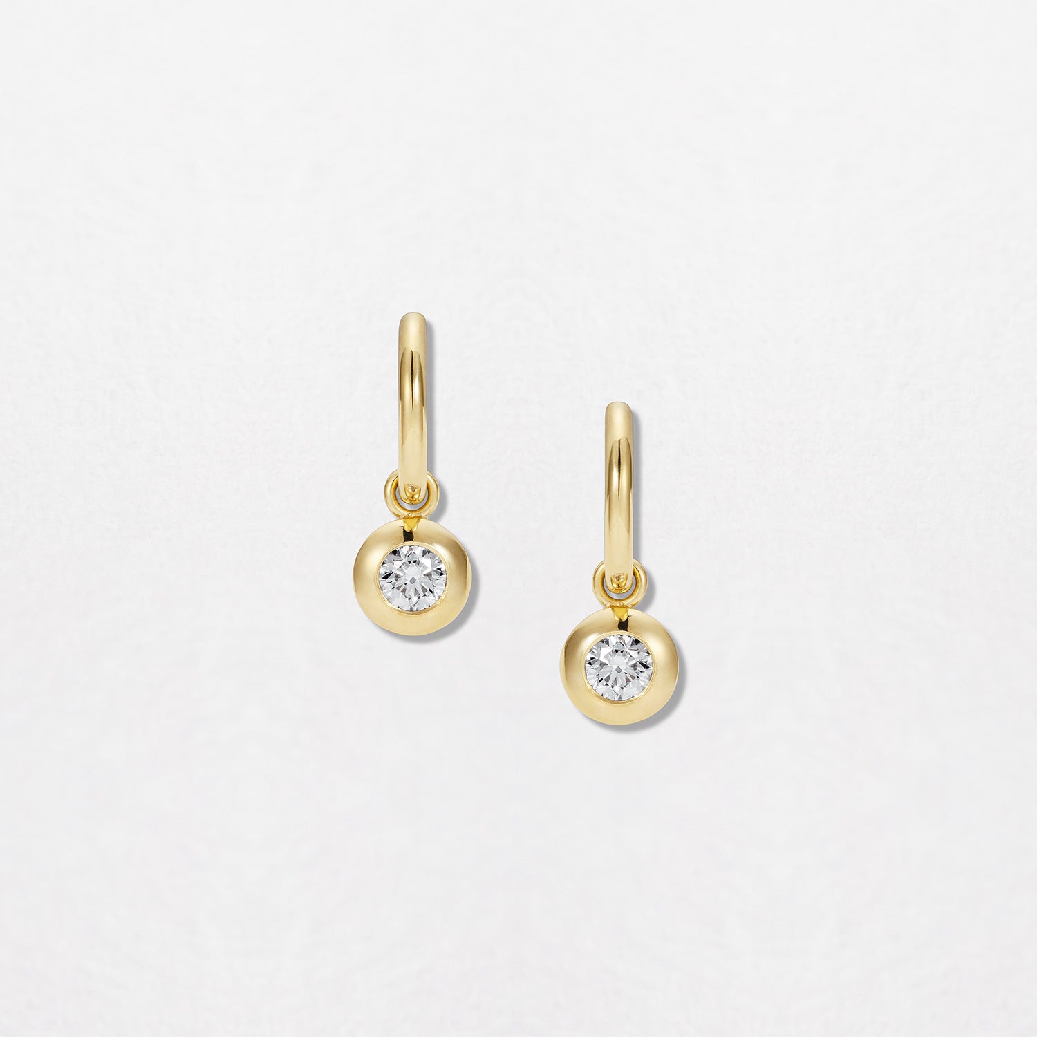 Handcrafted 18K yellow gold Diamond Pebble Hoop Earrings featuring 0.50ct round brilliant lab grown diamonds in bezel pebble settings with detachable drops by Isabella Roux.