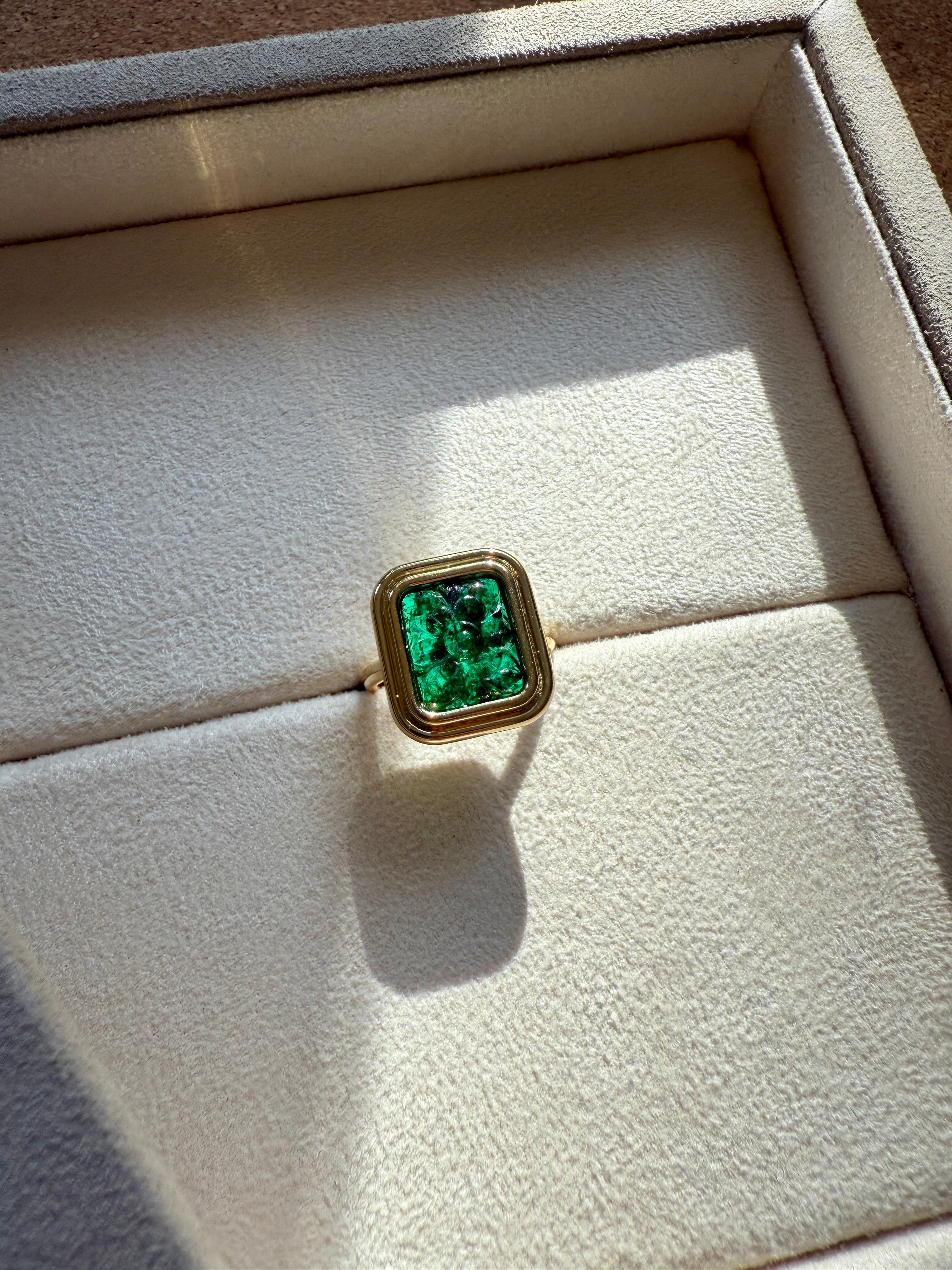 Bespoke Gold ring with a green gemstone in a jewellery box by Isabella Roux