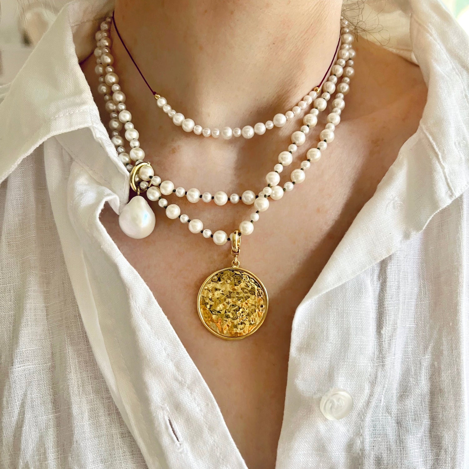 Handcrafted Pearl Cord Necklace featuring a mix of 3-6mm white freshwater pearls on a burgundy red cord with 18K yellow gold fittings by Isabella Roux