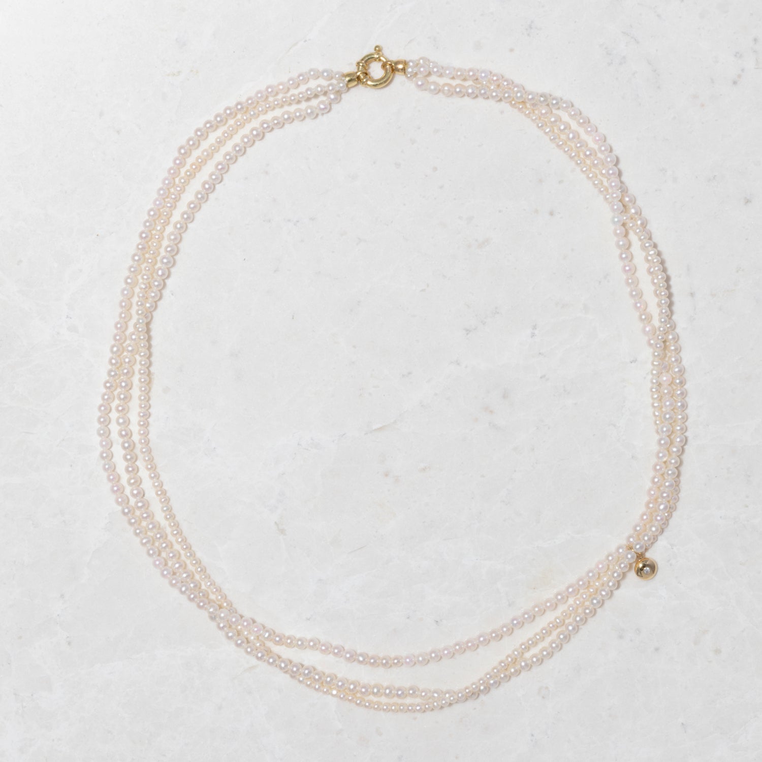 Handcrafted 18K yellow gold Akoya Pebble Seed Pearl Twist Collar Necklace featuring delicate seed pearls and a gold clasp by Isabella Roux.
