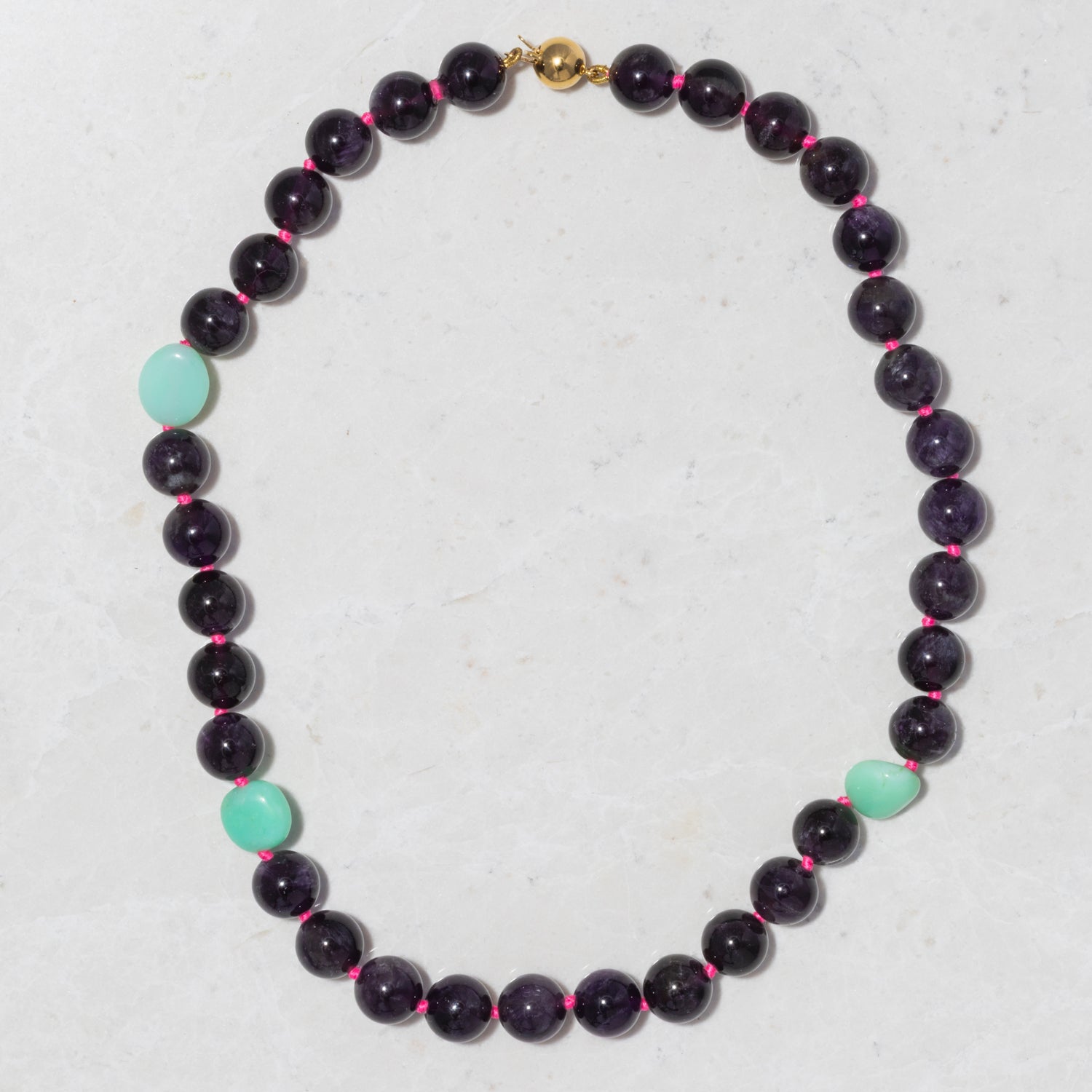 Handcrafted 18K yellow gold Pebble Amethyst & Chrysoprase Necklace featuring vibrant amethyst, green chrysoprase, and gold clasp by Isabella Roux.