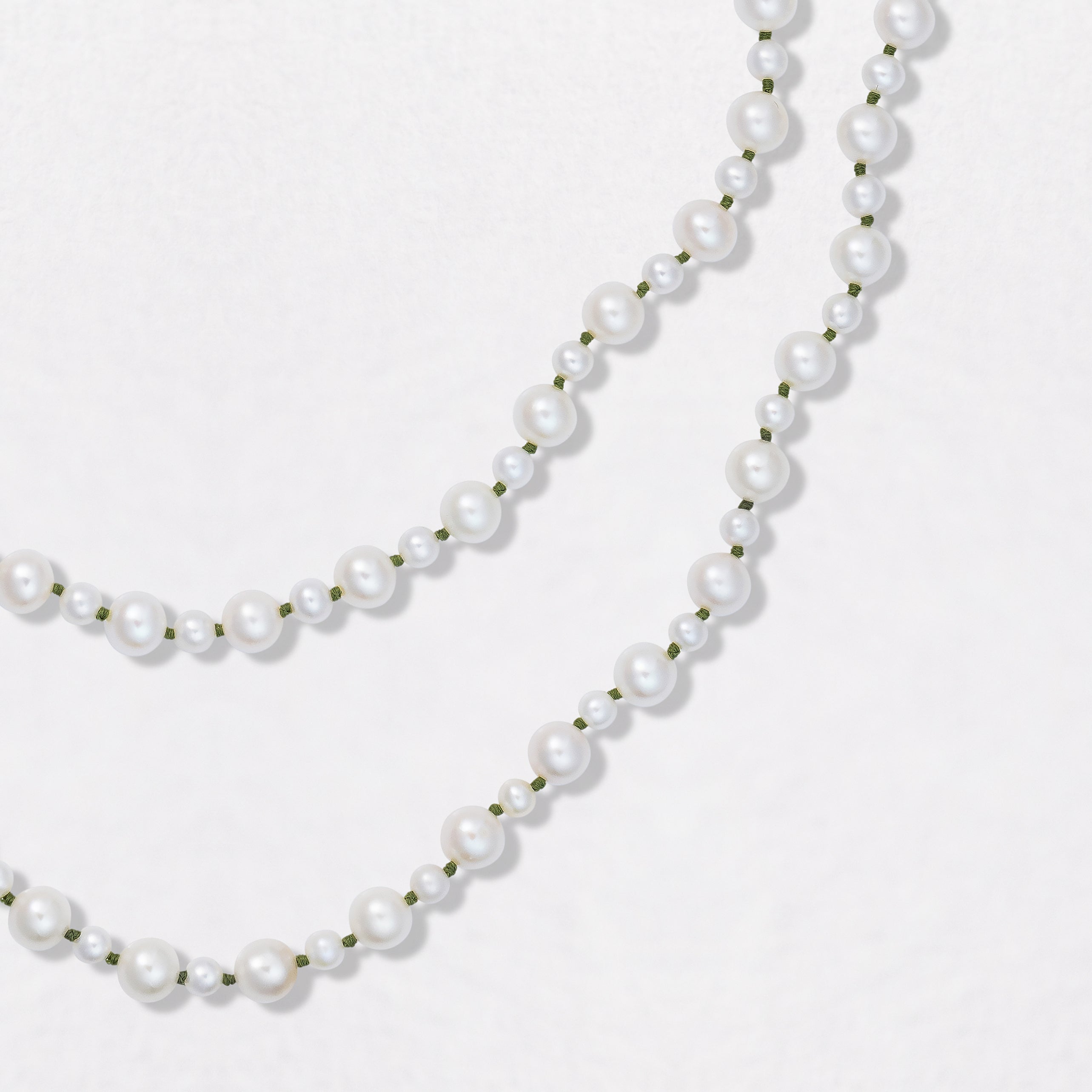 Handcrafted Pebble Pearl 15" Mini Necklace with freshwater pearls and 3.5 - 4.5mm and 18K yellow gold clasp on green thread by Isabella Roux.