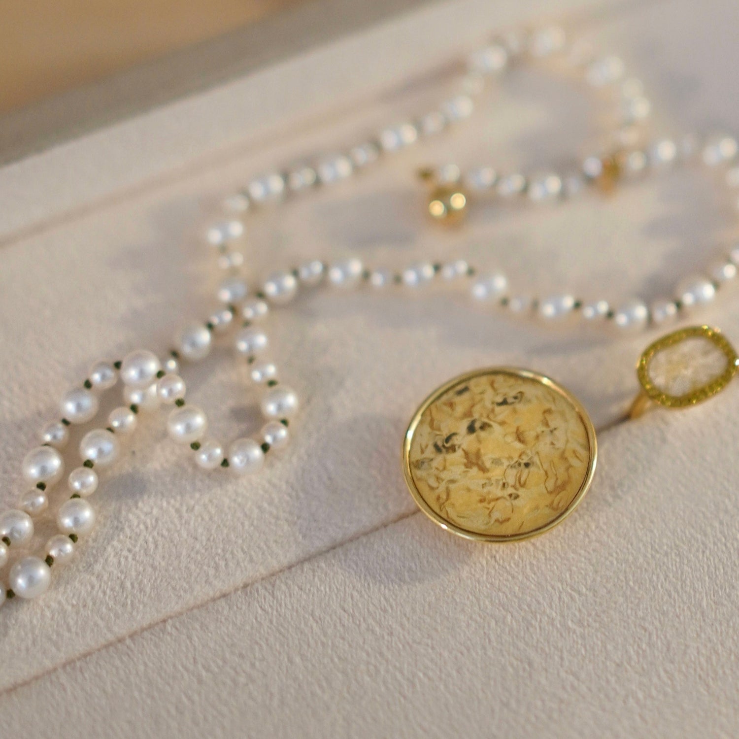 Handcrafted Pebble Pearl 22" Necklace featuring freshwater pearls in 3 - 5mm and 18K yellow gold clasp by Isabella Roux.