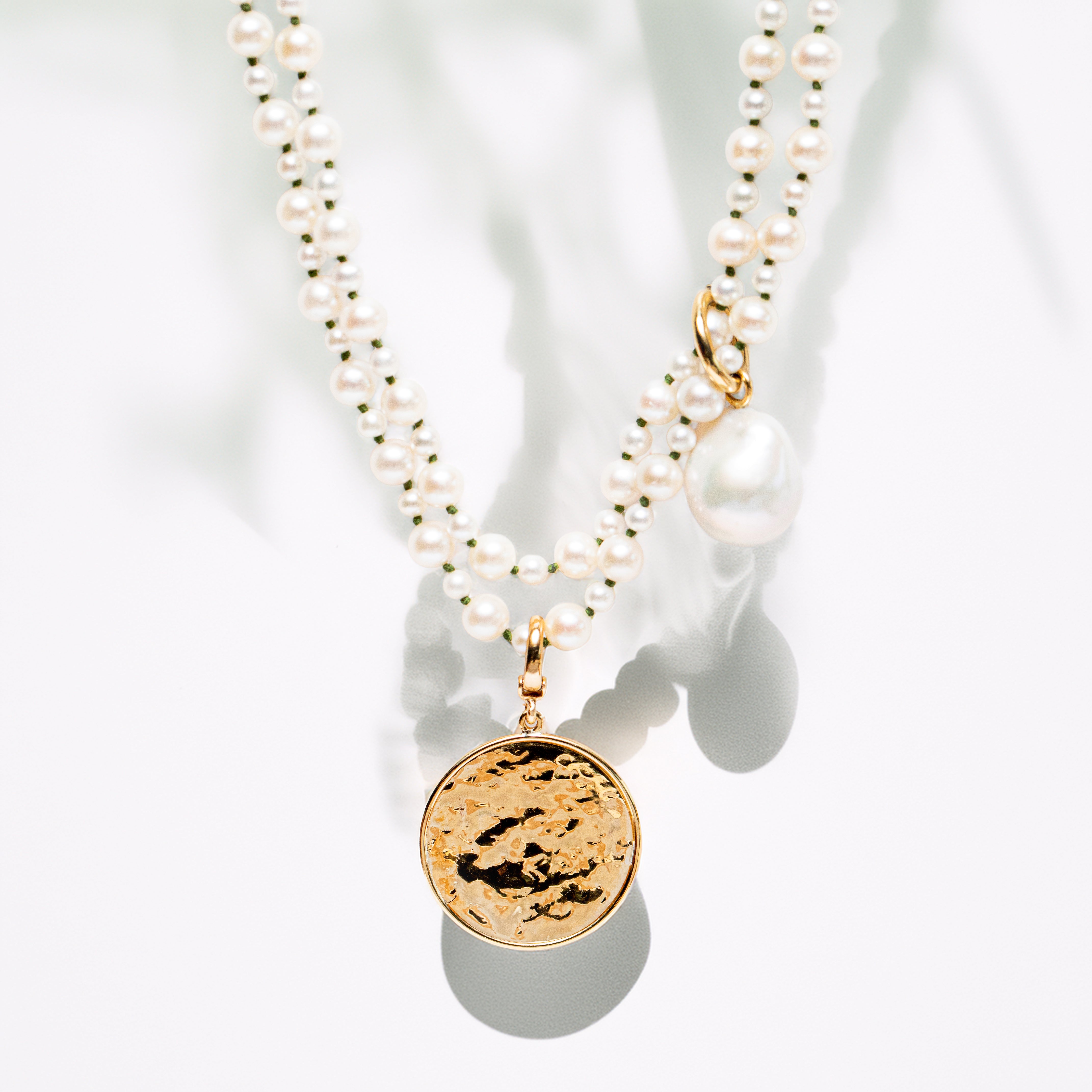 Handcrafted Pebble Pearl 32" Necklace featuring a long strand of round freshwater pearls and 18K yellow gold clasp by Isabella Roux.