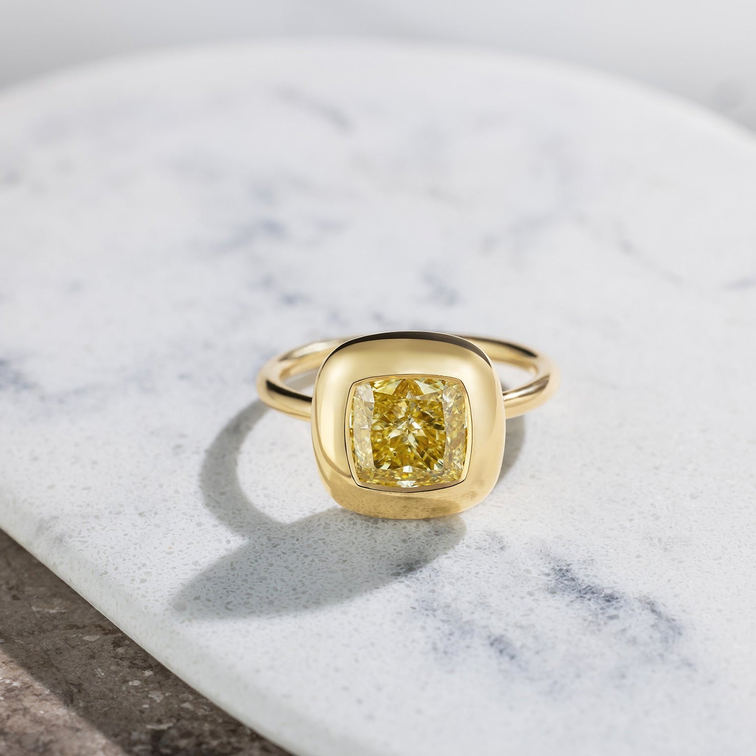 Handcrafted 18K yellow gold Yellow Diamond Cushion Cup Ring featuring a 2.21ct cushion cut lab grown yellow diamond set in a bezel style cup by Isabella Roux