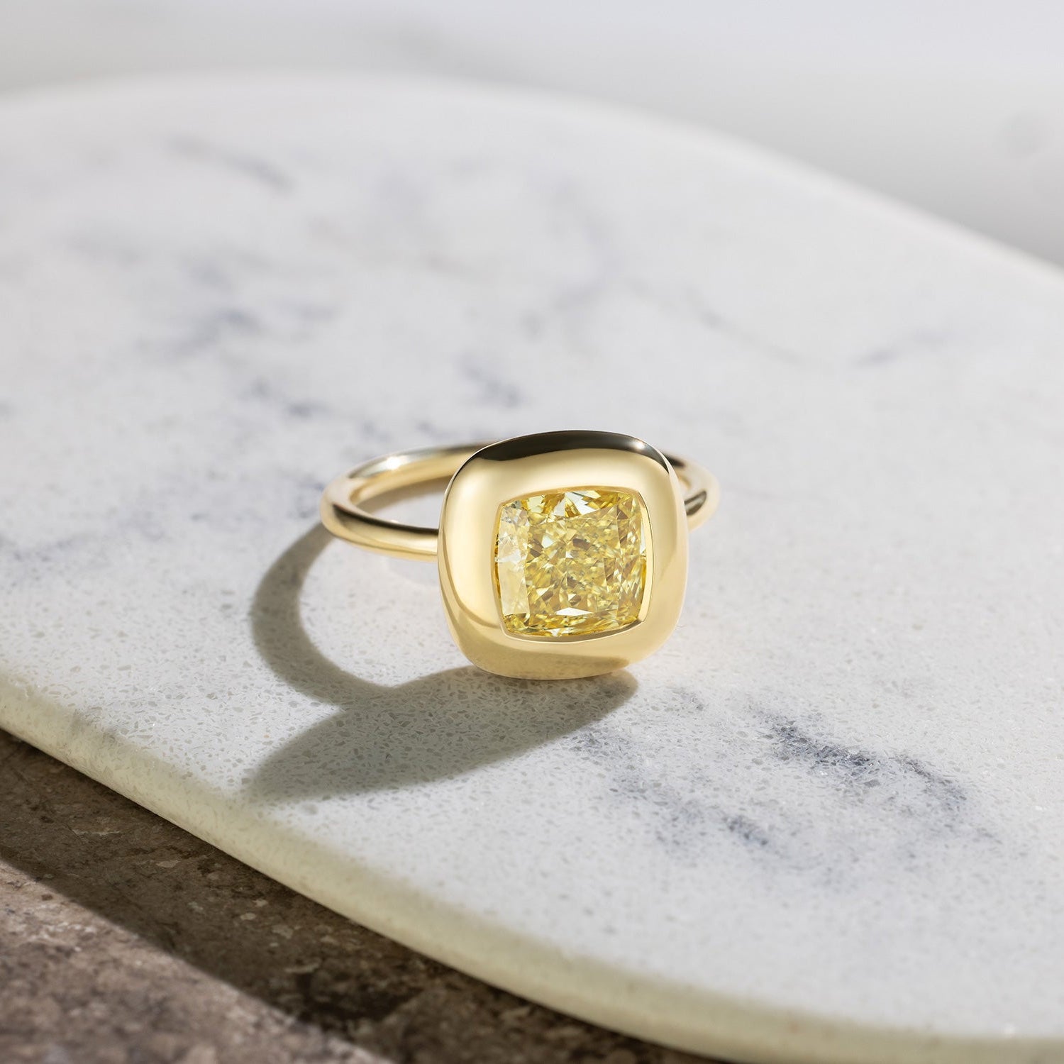 Handcrafted 18K yellow gold Yellow Diamond Cushion Cup Ring featuring a 2.21ct cushion cut lab grown yellow diamond set in a bezel style cup by Isabella Roux