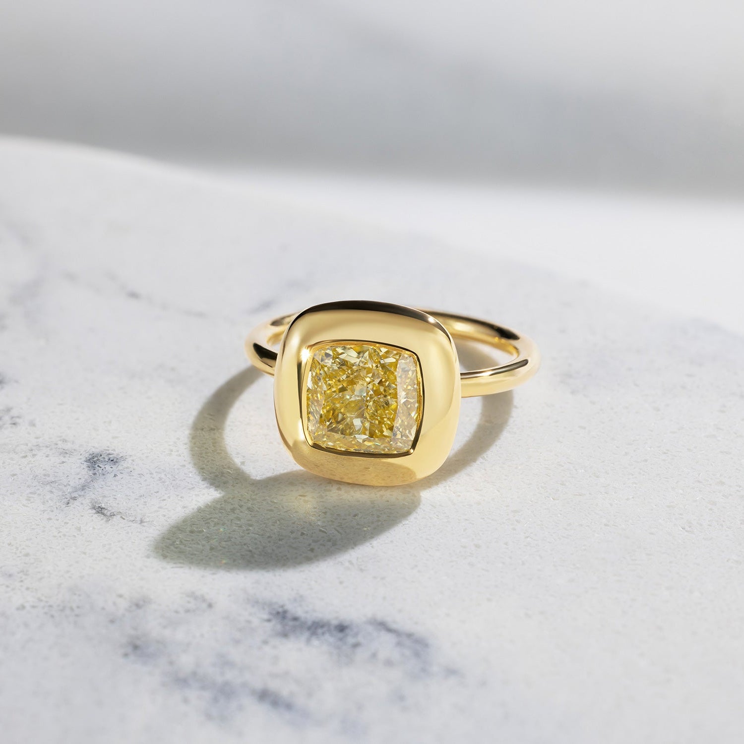 Handcrafted 18K yellow gold Yellow Diamond Cushion Cup Ring featuring a 2.21ct cushion cut lab grown yellow diamond set in a bezel style cup by Isabella Roux